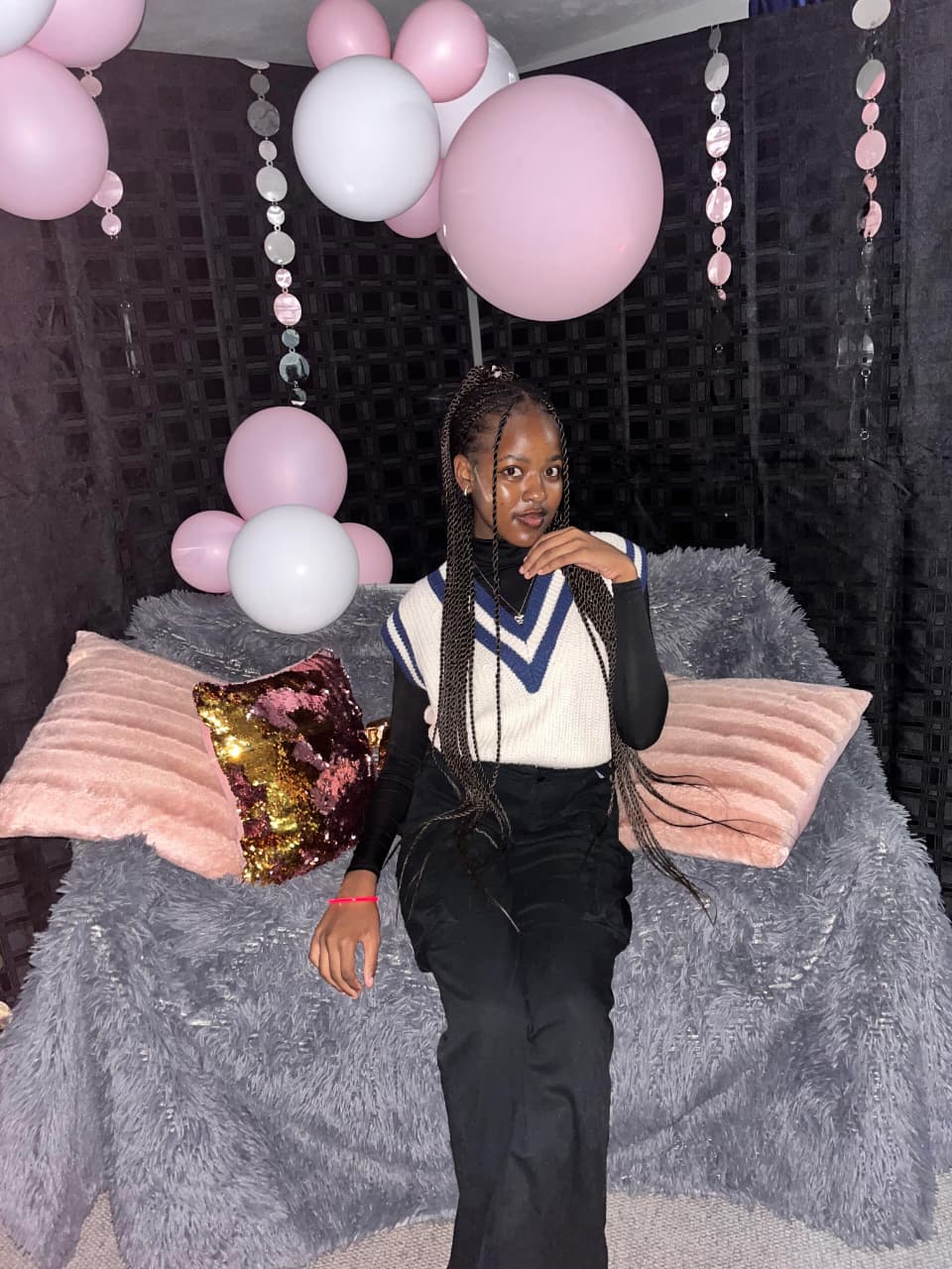 Beauty portrait, braided hair, balloon backdrop.